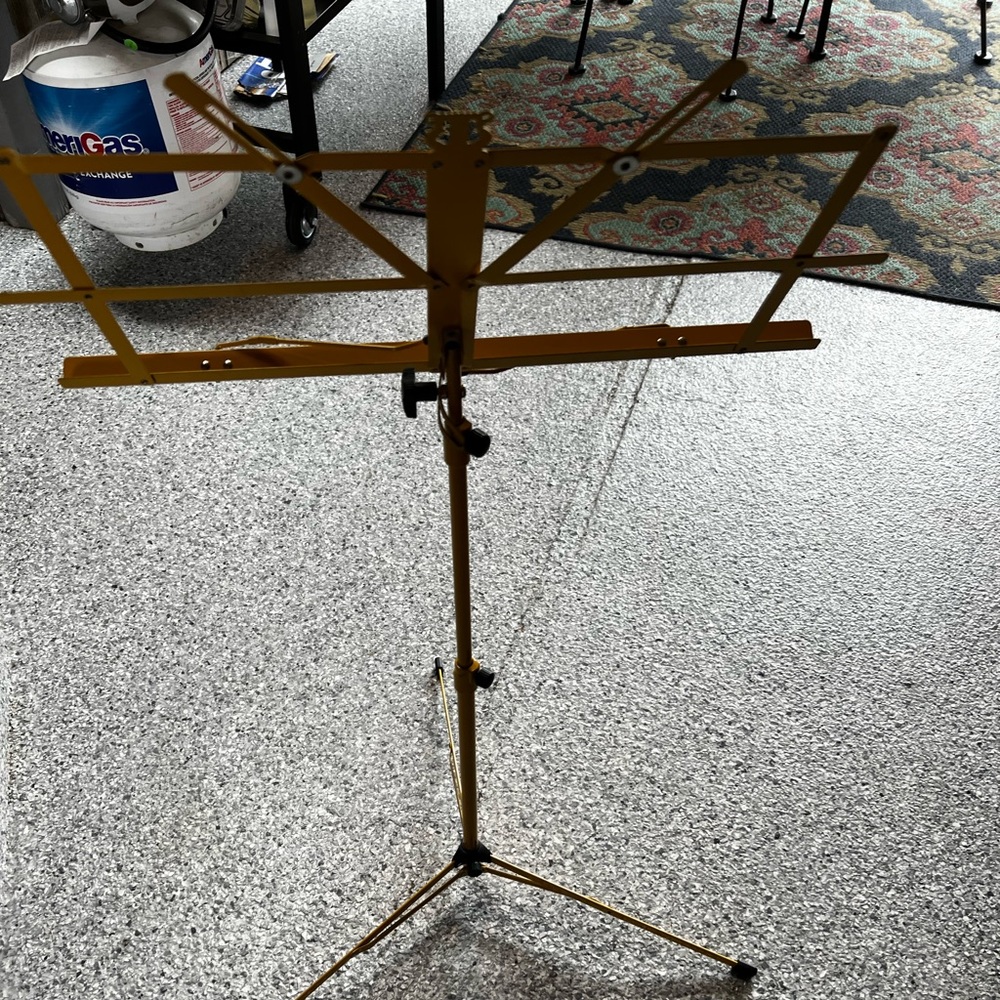 Foldable adjustable music sheet stand